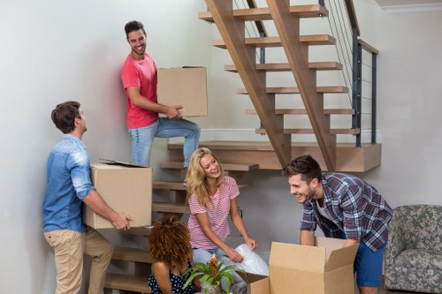 Removal team handling furniture in Sutton during a local move