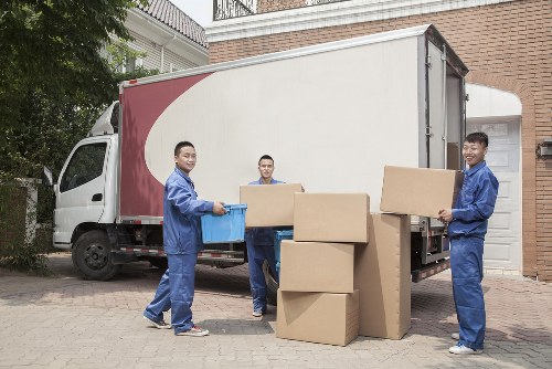 Piano removals team preparing an upright piano for safe transport in Sutton