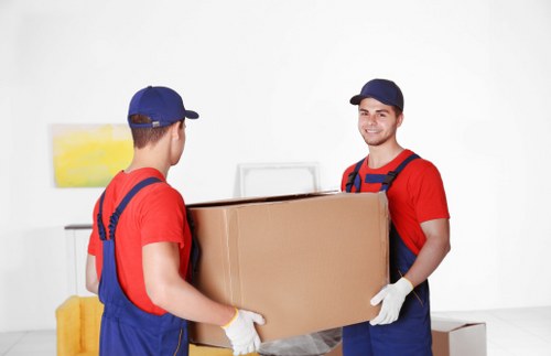 Removal team handling a home move in Sutton street with furniture loading