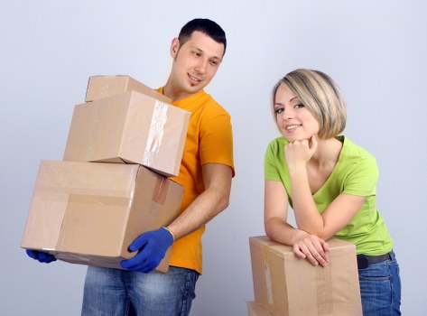 Careful loading of sofas and household furniture into a removals van