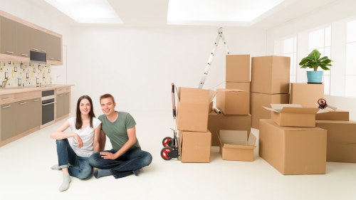 Professional removals team reviewing customer concerns