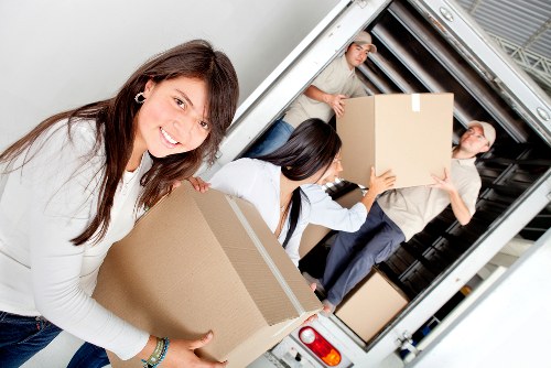 Furniture and boxes being moved with a truck service in Sutton