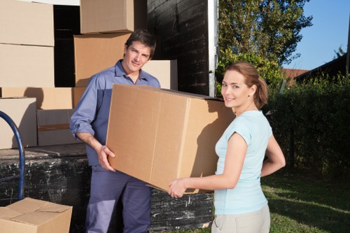 Furniture and boxes being separated for donation, reuse, and recycling during a move