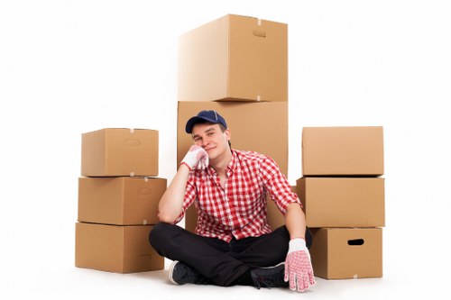 Professional removalists carrying furniture through a residential property in Sutton